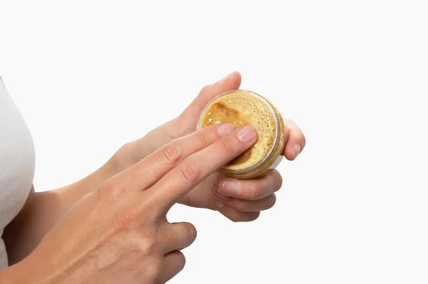 Scoop and warm Batana Oil